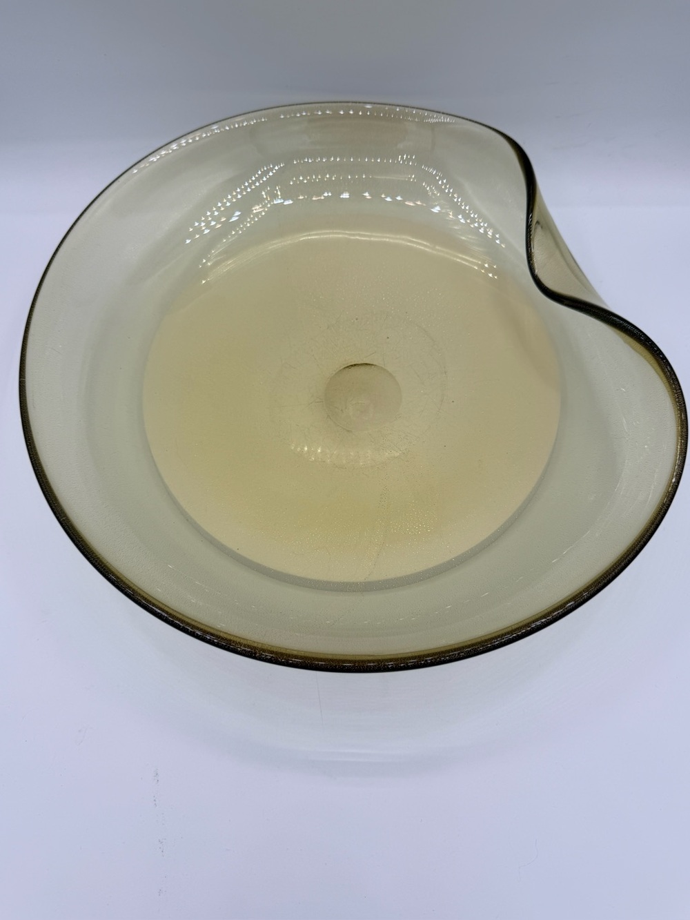 Mid-century Murano glass bowl with neutral amber hue and gold flecks